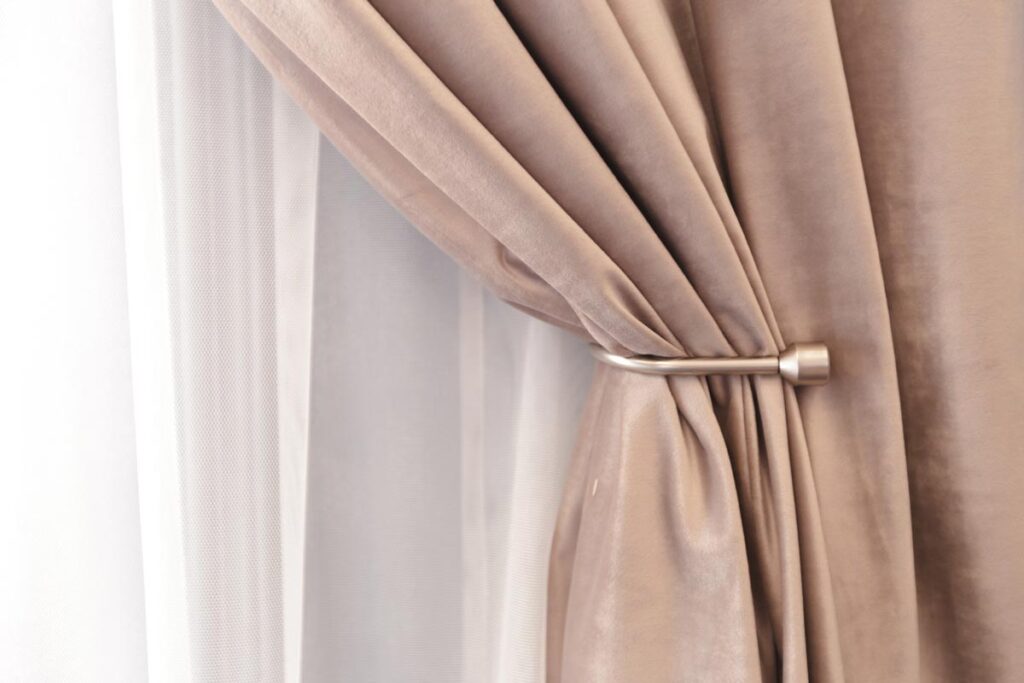 A curtain with a metal rod attached to it.